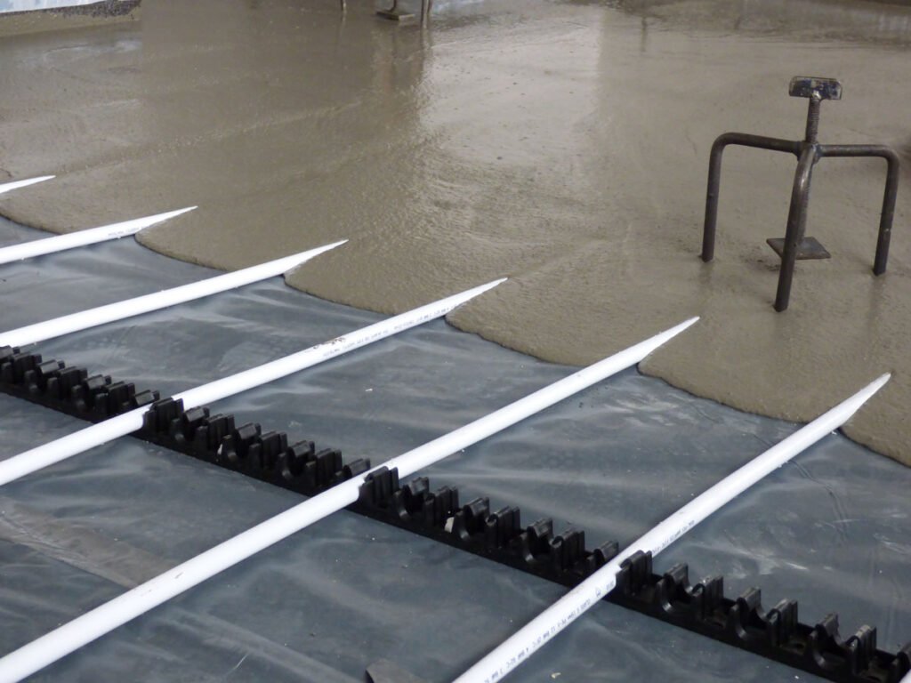 Liquid screed floor prepared for underfloor heating installation